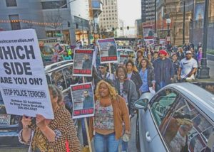 Thursday, Feb. 25 2016.    Protesters who rallied outside the downtown Seattle Police Department thread their way through traffic down 5th Ave. as they portest the killing of Che Taylor by Seattle Police.
