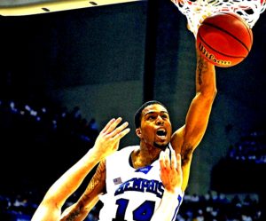 Memphis' Chris Douglas-Roberts (14) throws down a dunk over UCLA's Kevin Love during second half action in an NCAA Men's Basketball Championship Final Four semi-final game at the Alamodome in San Antonio, Texas, Saturday, April 5, 2008. Memphis defeated UCLA 78-63. (Jeff Siner/Charlotte Observer/MCT)